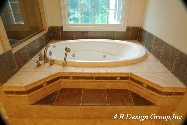 Deep soak tub with natural color stone